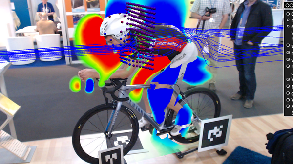 Augmented reality visualization of airflow superimposed on a real-life cyclist.