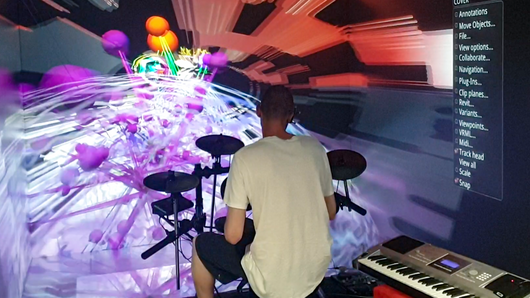 Photo of drummer in the HLRS CAVE virtual reality facility.