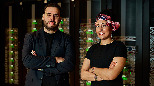 Photograph of Alaa Bejaoui and Maha Badri in the HLRS computing room.