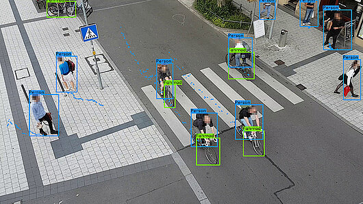 In this demonstration image, a machine learning algorithm identifies moving objects at a busy intersection.