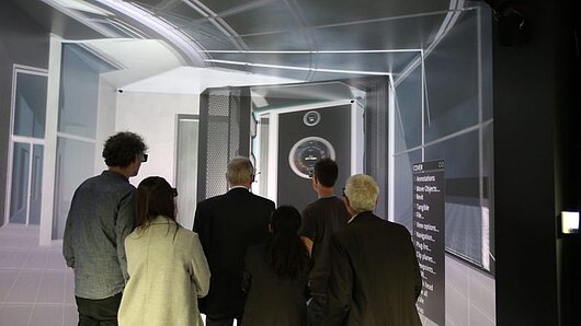 Photo of several people inside the HLRS CAVE.