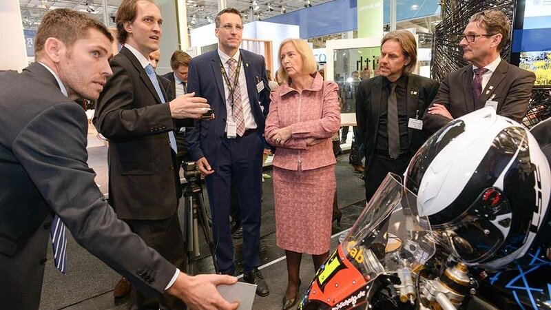 HLRS scientists demonstrate an augmented reality project at a convention.