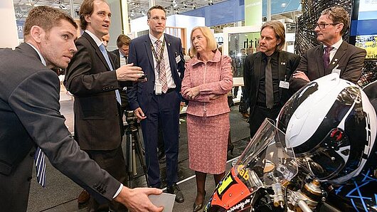 HLRS scientists demonstrate an augmented reality project at a convention.