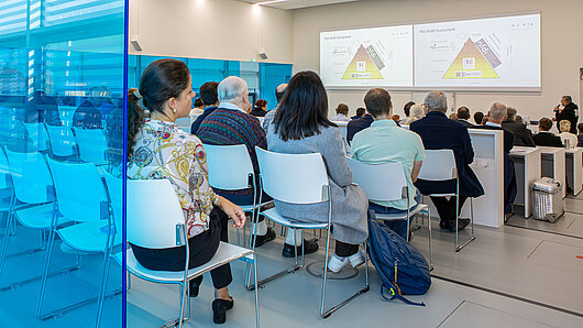 Photo of full HLRS Rühle Saal from back of room.