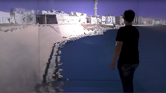 Visualization in the HLRS CAVE of water near a coastal city.