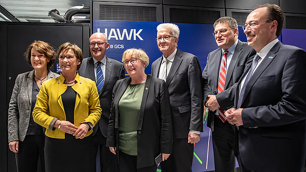 Photo of honorary guests in front of the Hawk supercomputer