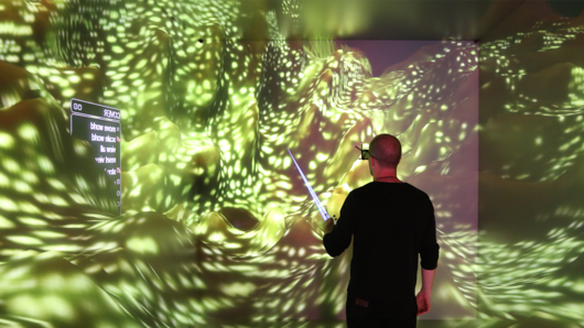 Photo of scientists observing 3D computer visualization