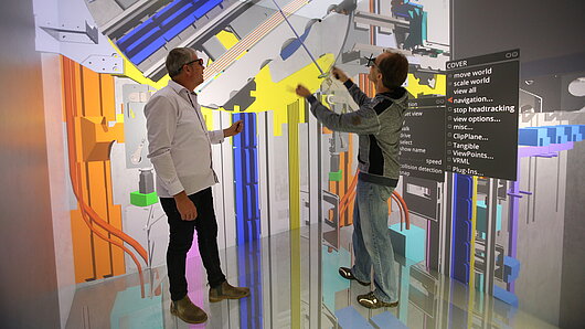 Researchers investigate the function of the MULTI elevator in virtual reality.