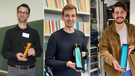 Golden Spike Award winners Björn Klose, Simon Homes, and Tim Niklas Uhl hold their trophies.