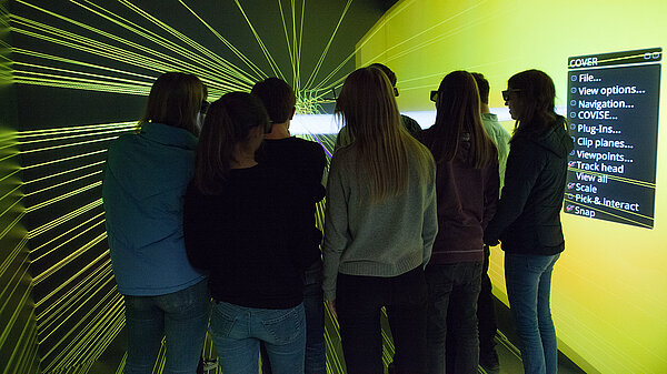 Photo of school children observing scientific visualization