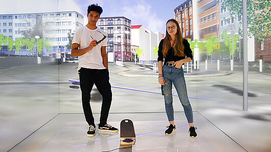 Students test a virtual skateboarding application in the HLRS CAVE.
